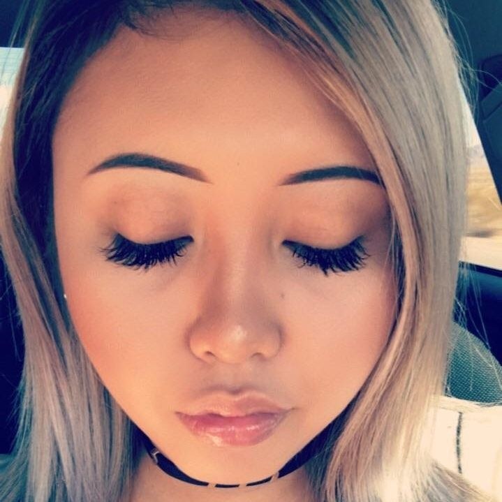 Guest with completed eyelash extensions, eyes softly closed