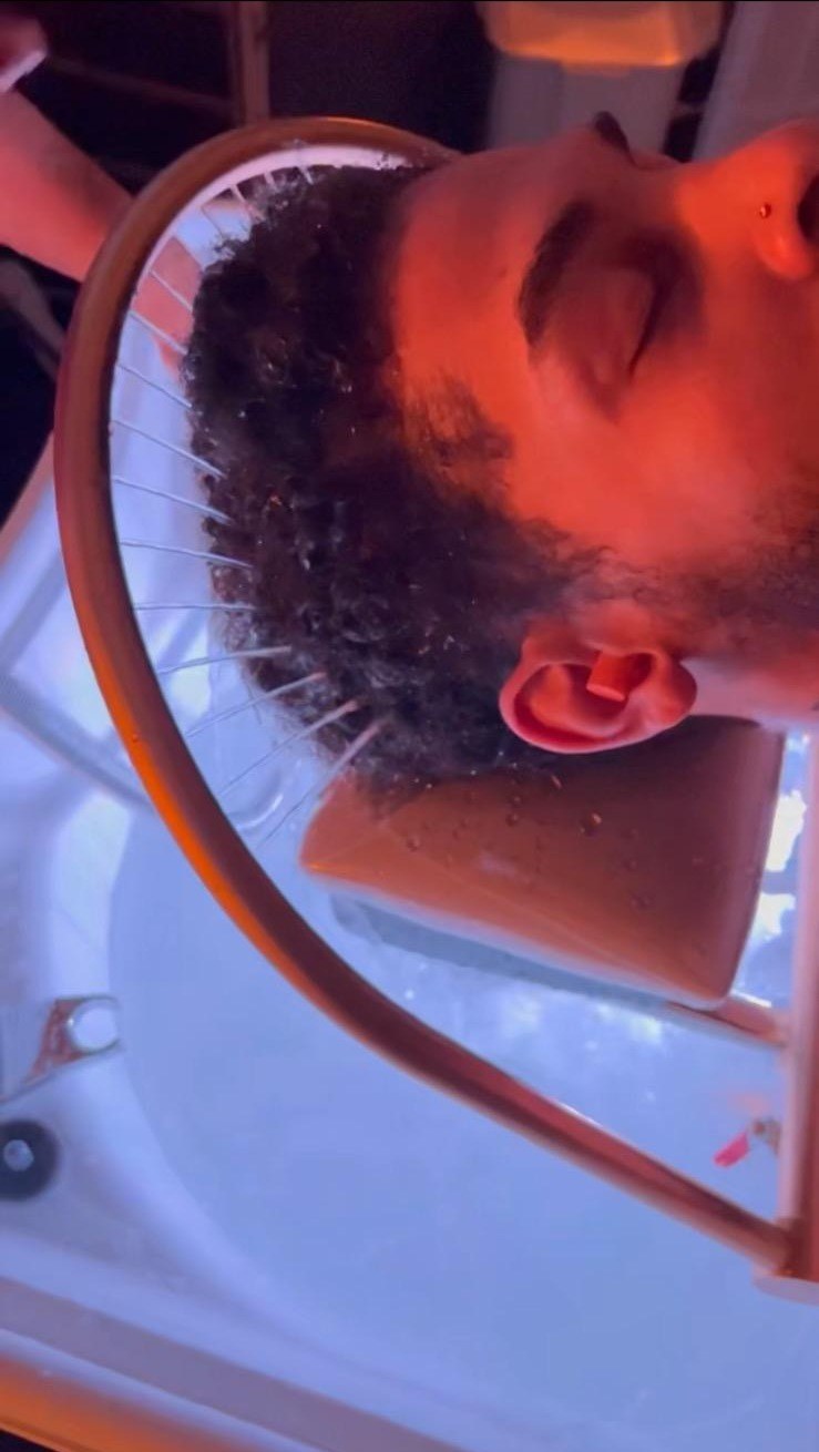 Warm red light therapy during a Japanese head spa session