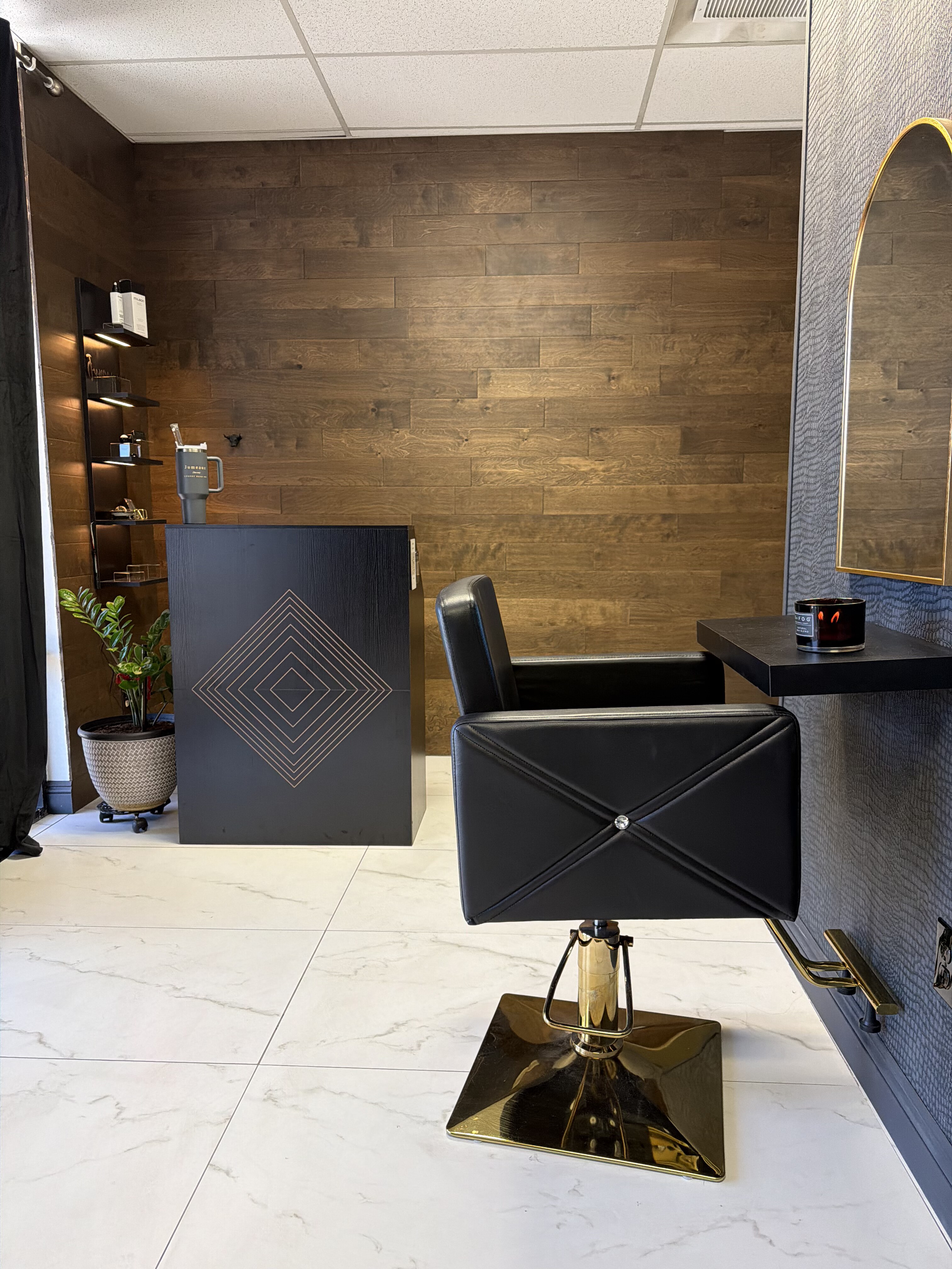 Private consultation and styling room with walnut walls at Jumeaux